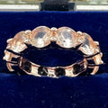 Rose gold tone peach champagne glass gemstones ring eternity band size 5.5