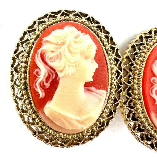 1928 signed gold tone pink resin cameo woman's face oval clip on earrings