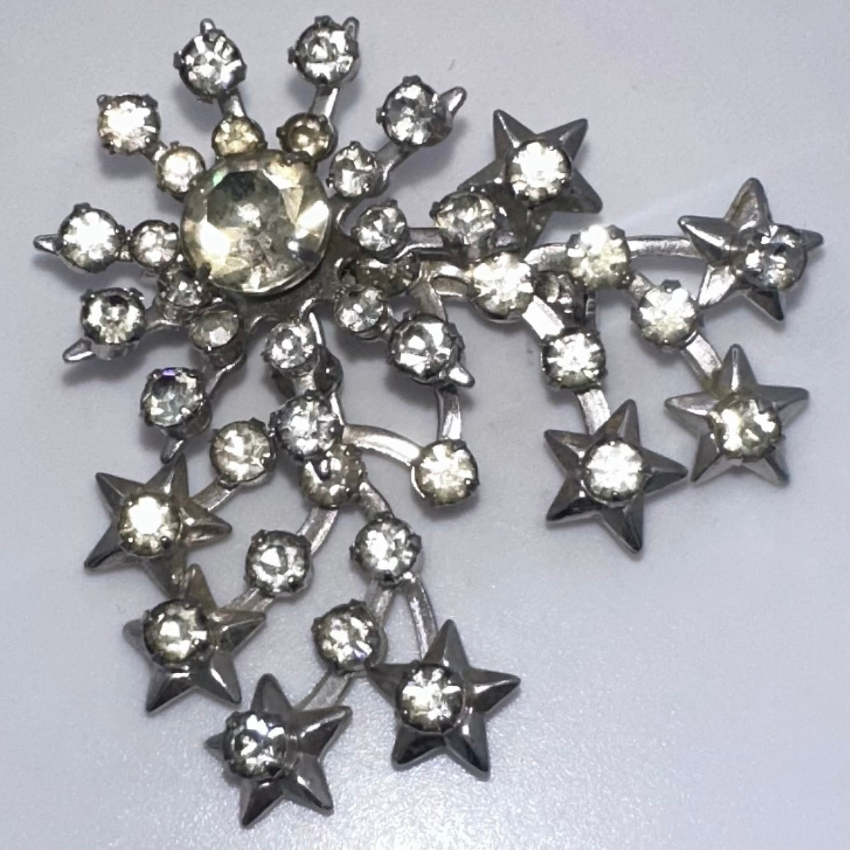 Unsigned Schurin vintage silver tone clear rhinestones stars starburst brooch