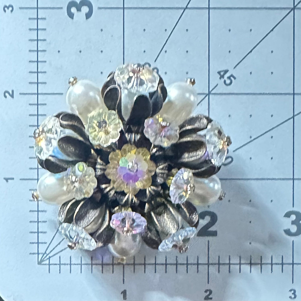 Unsigned Schiaparelli gold tone aurora borealis AB margarita faux pearls brooch