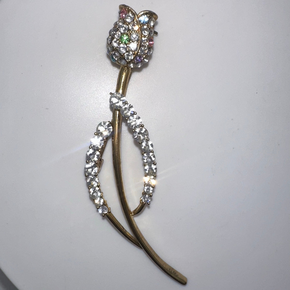 Gold tone clear multicolor glass rhinestones rose flower floral brooch