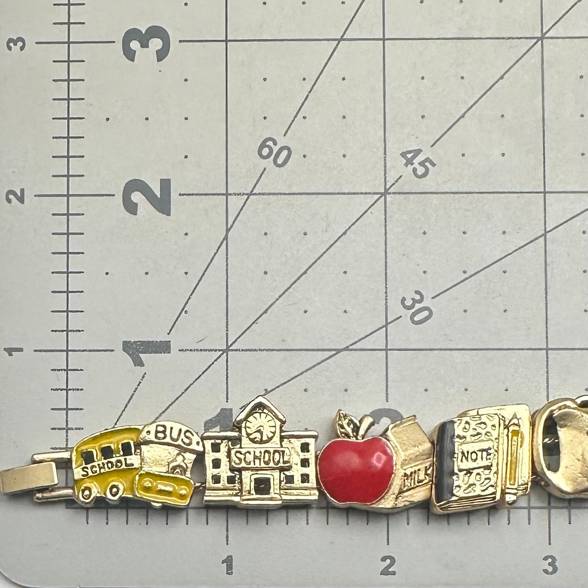 Vintage gold tone school teacher red yellow enamel slider charms bracelet