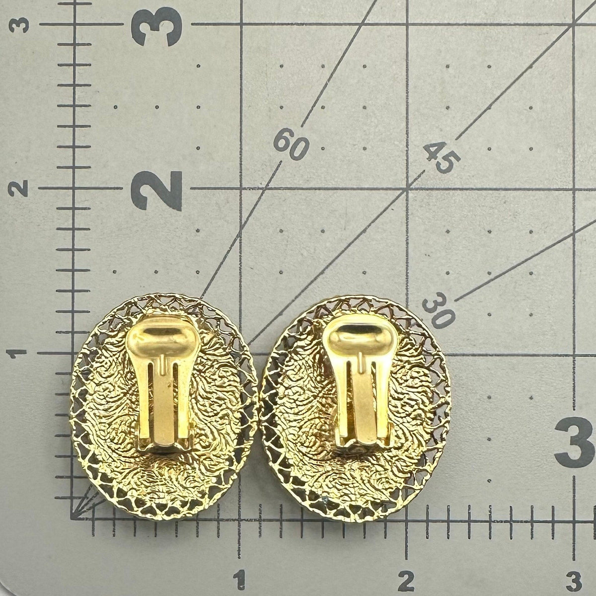 1928 signed gold tone pink resin cameo woman's face oval clip on earrings