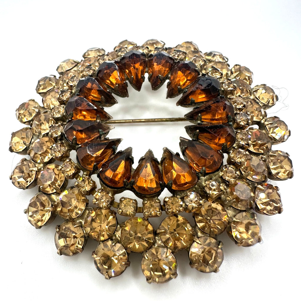 Vintage gold tone amber topaz glass rhinestones round circular wreath brooch