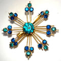 Vintage 1950s gold tone blue teal rhinestones starburst Sputnik brooch