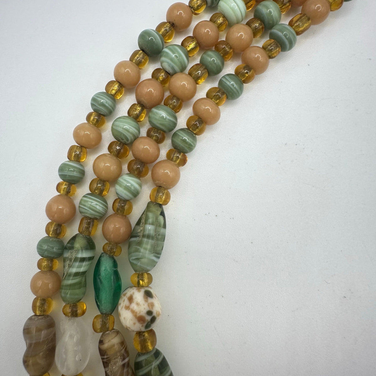 Japan vintage 4 multi strand green tan amber art glass beaded graduated necklace