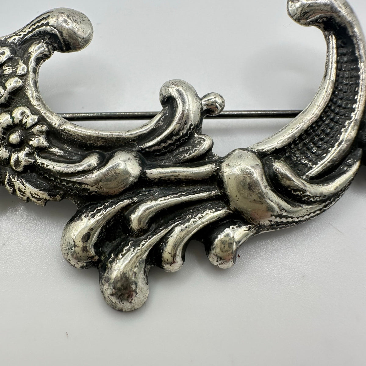 Vintage silver tone Art Nouveau Revival embossed scrollwork floral brooch