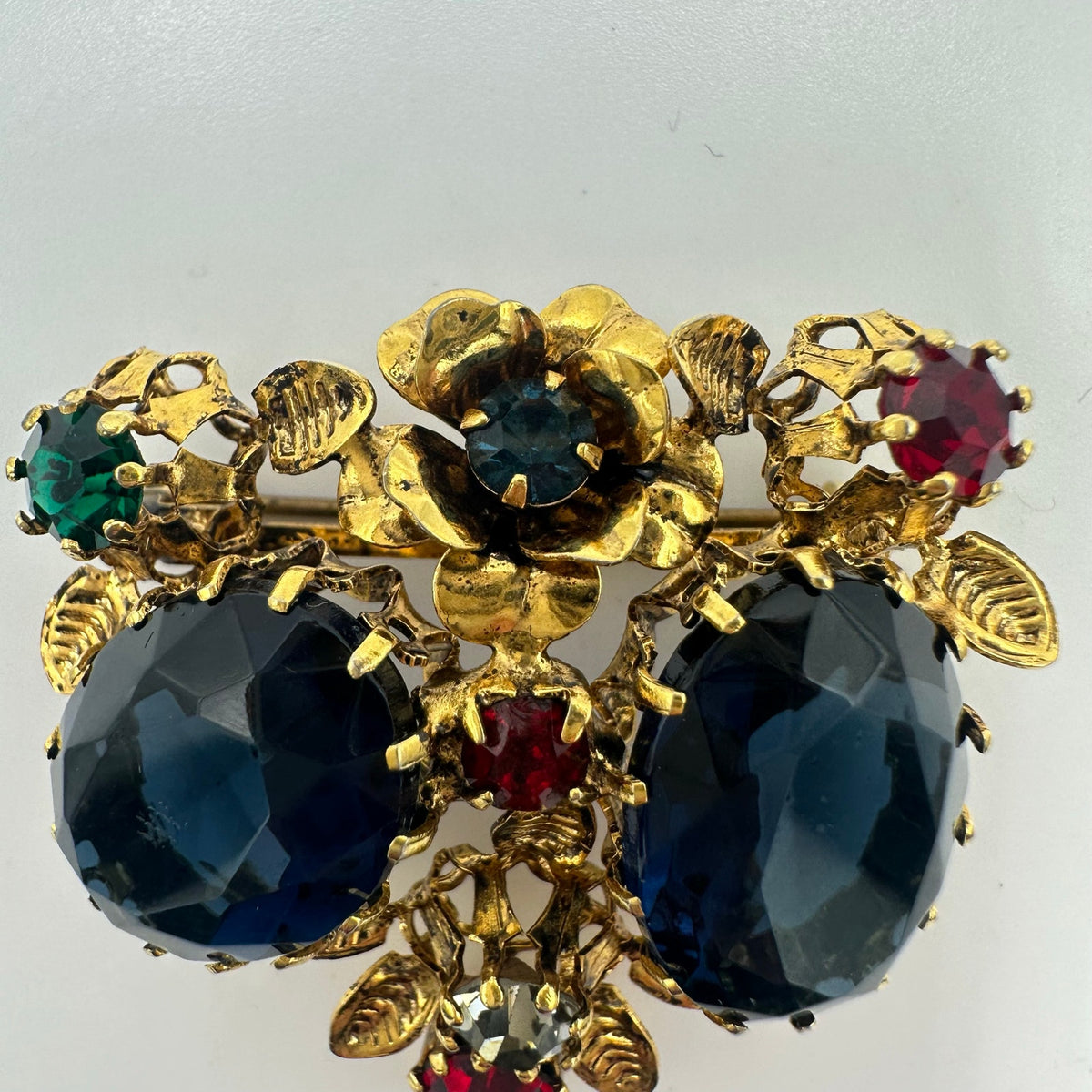 Unsigned Austria 1950s vintage gold tone multicolor rhinestones floral brooch