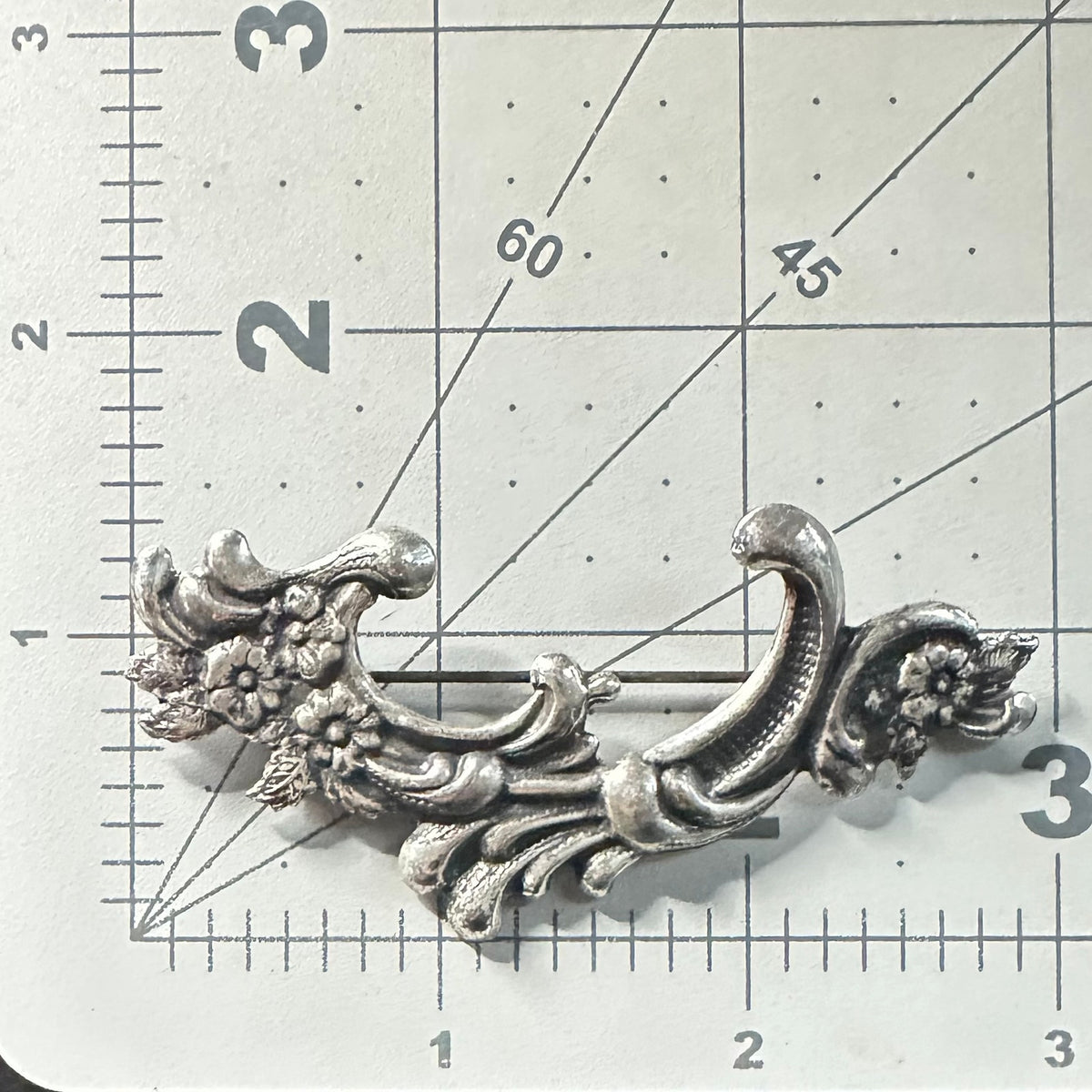 Vintage silver tone Art Nouveau Revival embossed scrollwork floral brooch