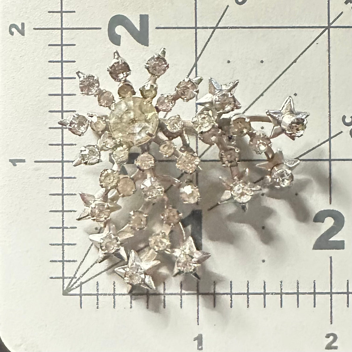 Unsigned Schurin vintage silver tone clear rhinestones stars starburst brooch