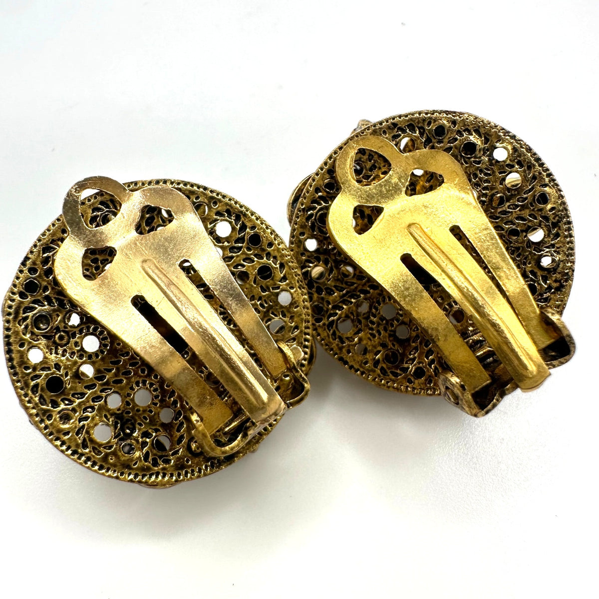 Vintage 1950s gold tone filigree purple glass rhinestones clip on earrings