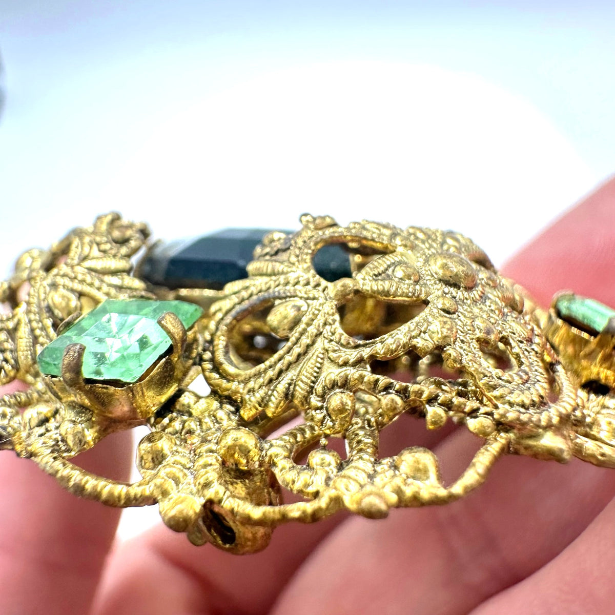 Vintage 1950s gold tone filigree massive emerald light green rhinestones brooch