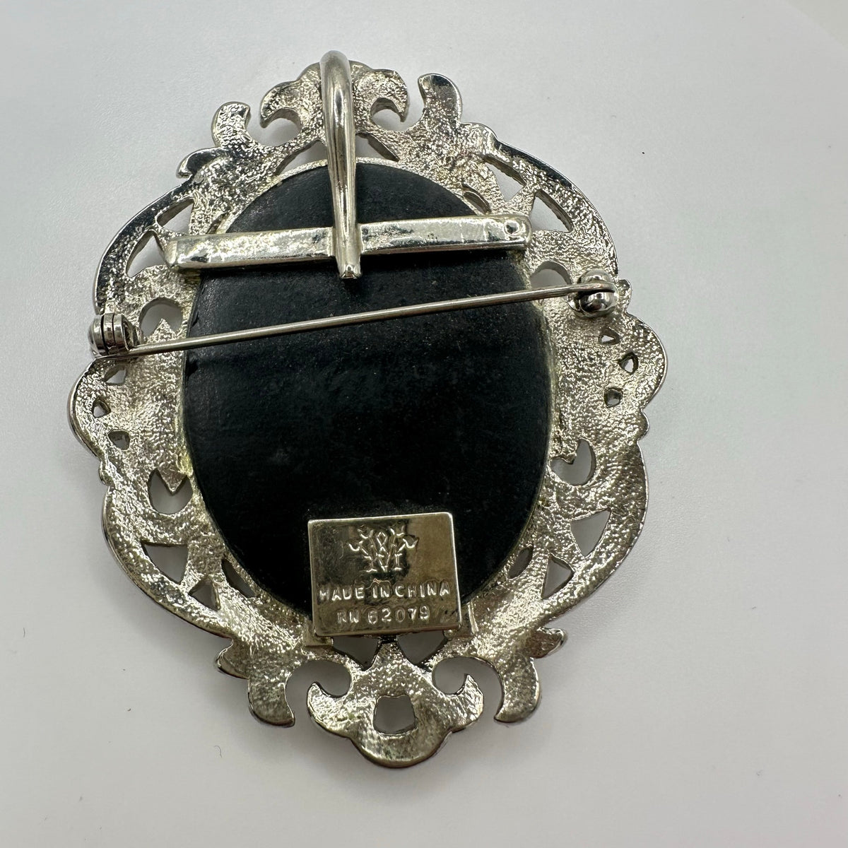 Silver tone rhodium plated genuine marcasite black white cameo brooch pendant