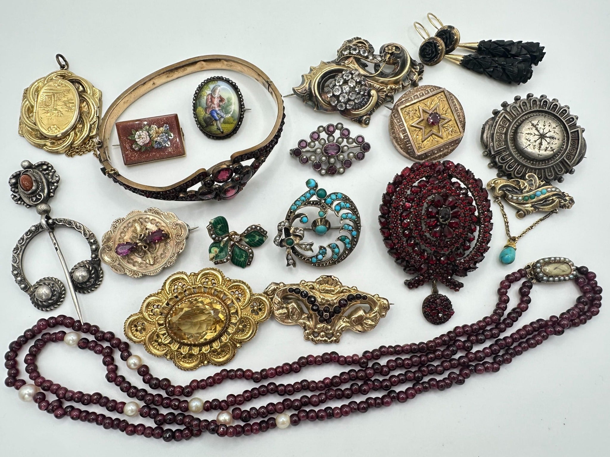 A curated assortment of antique and vintage jewelry